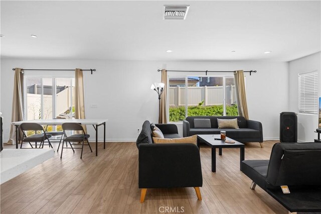 20225 Breeze Blooms Dr, Riverside, CA 92507 - living room with light wood-type flooring and recessed lighting