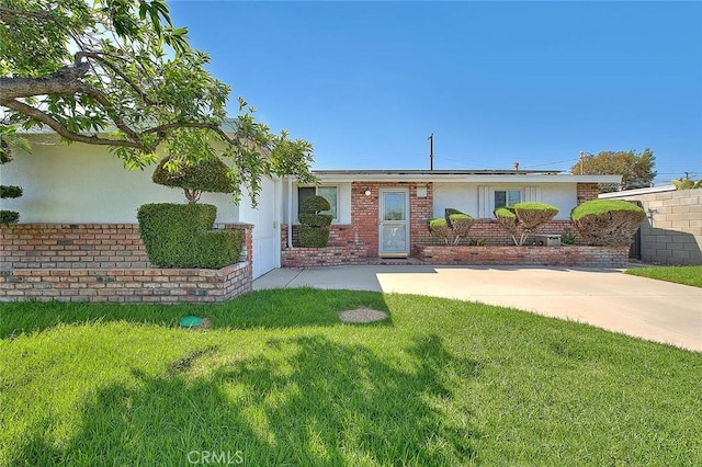 17109 E Orkney St, Azusa, CA 91702 - ranch-style house with brick siding, a front yard, roof mounted solar panels, and stucco siding