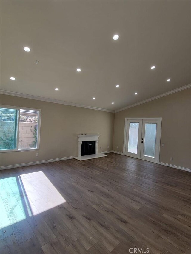 955 Mill Iron Way, San Jacinto, CA 92583 - unfurnished living room with crown molding, dark wood-style floors, recessed lighting, french doors, and a fireplace with raised hearth