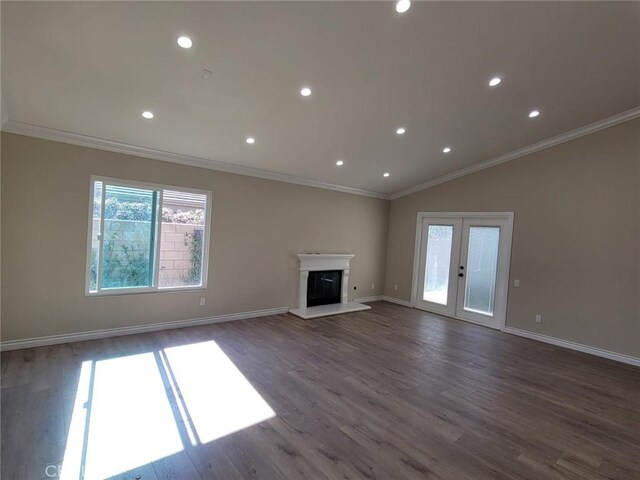 955 Mill Iron Way, San Jacinto, CA 92583 - unfurnished living room featuring wood finished floors, french doors, recessed lighting, a glass covered fireplace, and ornamental molding