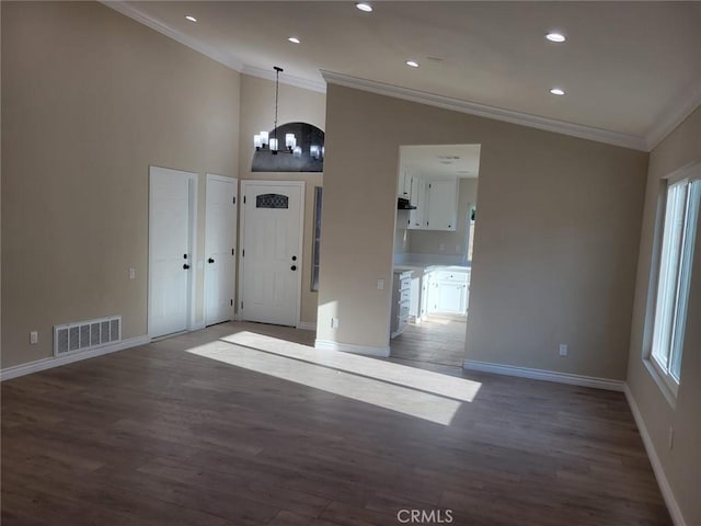 955 Mill Iron Way, San Jacinto, CA 92583 - foyer with crown molding, wood finished floors, a chandelier, vaulted ceiling, and recessed lighting