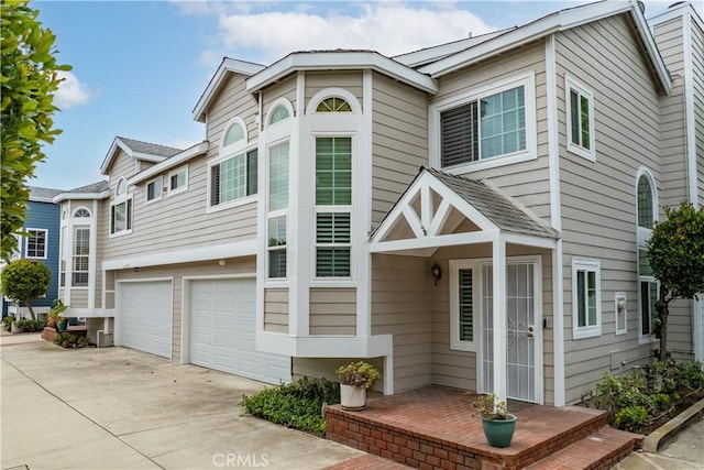 2547 Orange Ave Unit D, Costa Mesa, CA 92627 - view of property with a garage and driveway