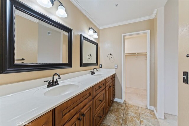 2547 Orange Ave Unit D, Costa Mesa, CA 92627 - bathroom featuring ornamental molding, double vanity, and a walk in closet