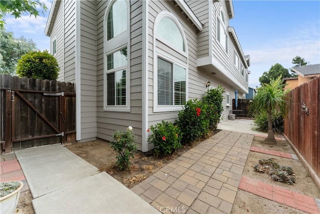 2547 Orange Ave Unit D, Costa Mesa, CA 92627 - view of side of property with a fenced backyard and a patio