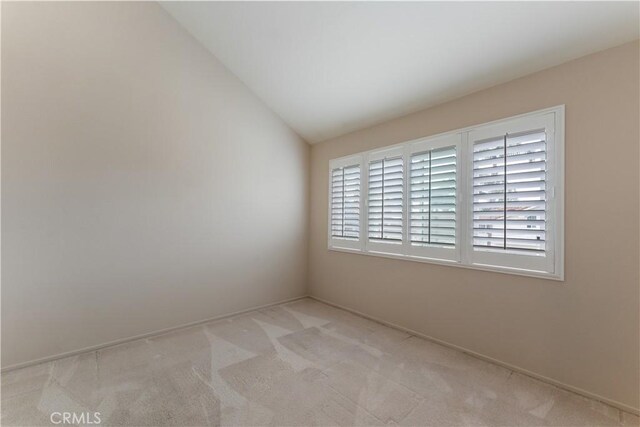 2547 Orange Ave Unit D, Costa Mesa, CA 92627 - unfurnished room with light colored carpet and vaulted ceiling