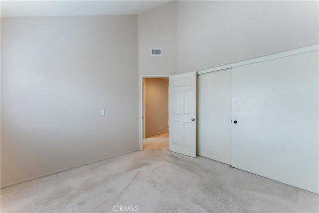 2547 Orange Ave Unit D, Costa Mesa, CA 92627 - unfurnished bedroom with a high ceiling, light colored carpet, and a closet