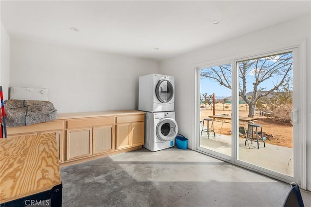 2654 Olympic Rd, Joshua Tree, CA 92252 - laundry area with estacked washer and dryer and cabinet space