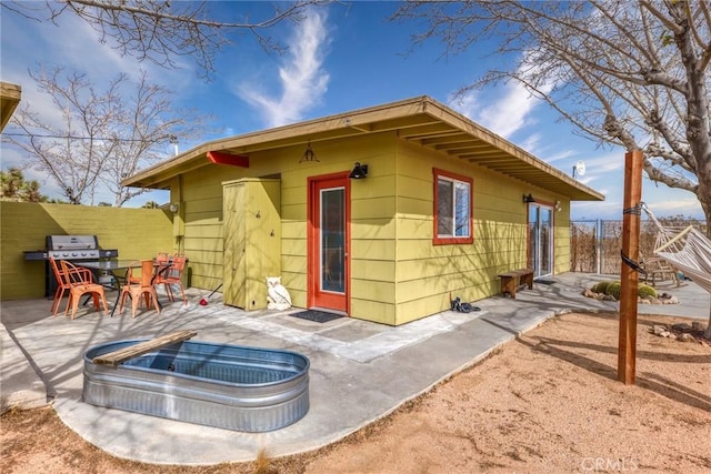 2654 Olympic Rd, Joshua Tree, CA 92252 - rear view of house featuring a patio area and outdoor dining area