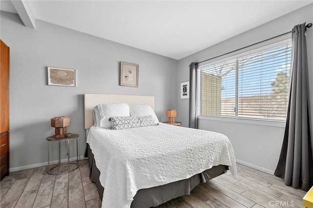 2654 Olympic Rd, Joshua Tree, CA 92252 - bedroom with light wood finished floors and multiple windows