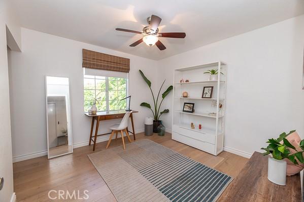 1186 Buelah Ave, City Terrace, CA 90063 - living area featuring an office area, ceiling fan, wood finished floors, and built in features