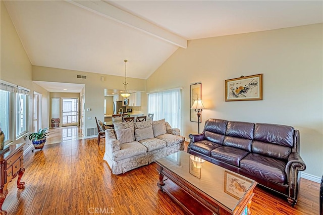 25312 Cassandra Ct, Mission Viejo, CA 92691 - living room featuring wood finished floors, beam ceiling, and high vaulted ceiling