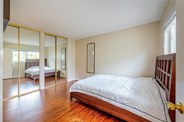 25312 Cassandra Ct, Mission Viejo, CA 92691 - bedroom featuring two closets and wood finished floors