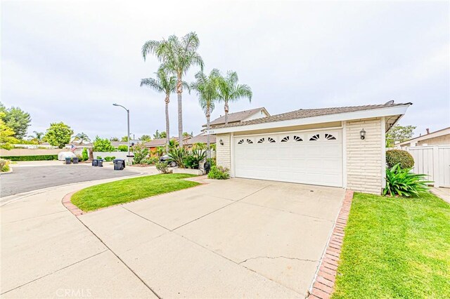 25312 Cassandra Ct, Mission Viejo, CA 92691 - view of front of house featuring a garage, driveway, and brick siding