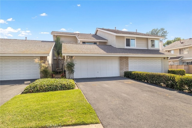 56 Ashbrook, Irvine, CA 92604 - view of front of home featuring asphalt driveway and a garage