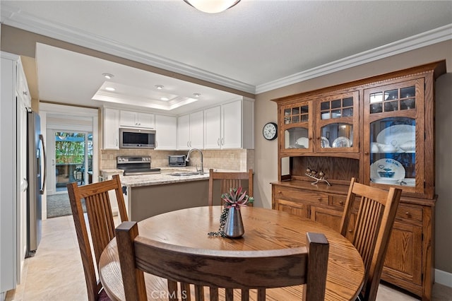 56 Ashbrook, Irvine, CA 92604 - dining area with ornamental molding, a raised ceiling, and recessed lighting