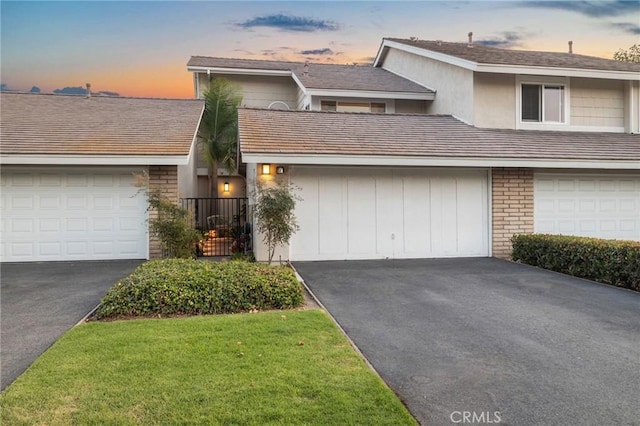 56 Ashbrook, Irvine, CA 92604 - view of front facade featuring asphalt driveway and a garage