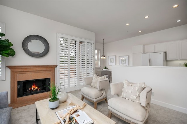 1501 Reggio Aisle, Irvine, CA 92606 - carpeted living room featuring recessed lighting and a lit fireplace