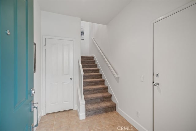 1501 Reggio Aisle, Irvine, CA 92606 - stairs featuring tile patterned floors and baseboards