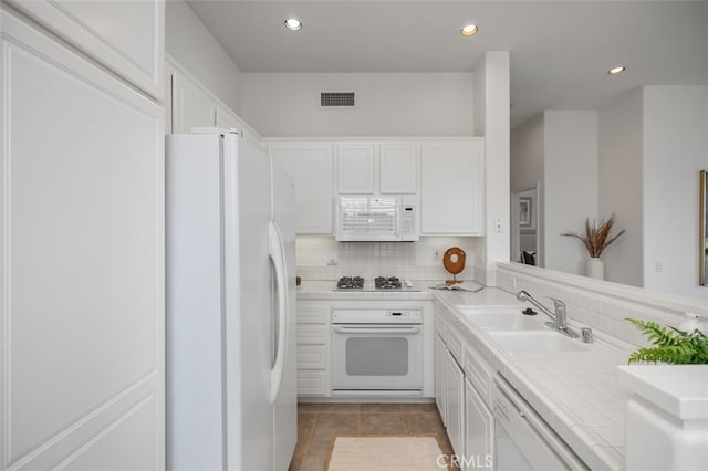 1501 Reggio Aisle, Irvine, CA 92606 - kitchen featuring white appliances, tile countertops, white cabinets, recessed lighting, and light tile patterned floors