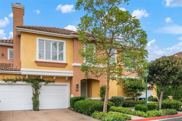 1501 Reggio Aisle, Irvine, CA 92606 - view of front of home with an attached garage, driveway, a chimney, and stucco siding