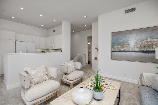 1501 Reggio Aisle, Irvine, CA 92606 - living area featuring light carpet and recessed lighting