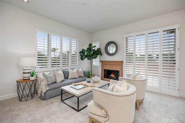 1501 Reggio Aisle, Irvine, CA 92606 - living area with carpet floors, a warm lit fireplace, and recessed lighting