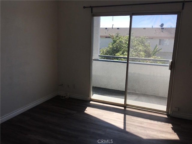 1509 W 146th St Unit 5, Gardena, CA 90247 - empty room featuring dark wood-style flooring and baseboards