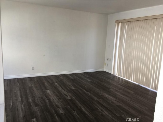 1509 W 146th St Unit 5, Gardena, CA 90247 - empty room featuring dark wood-type flooring and baseboards