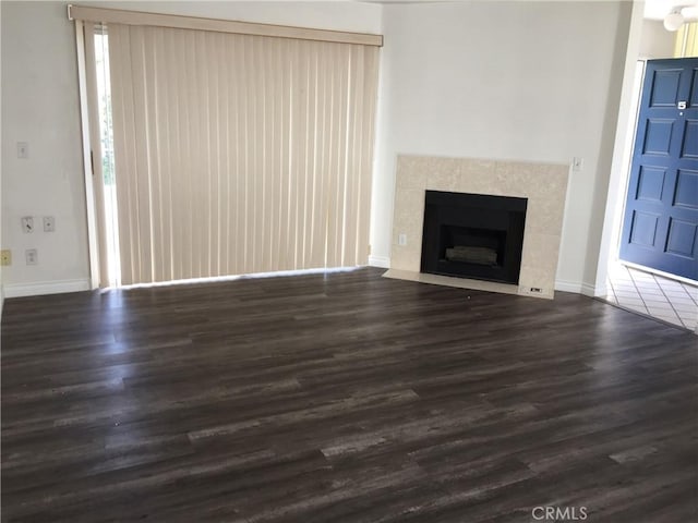 1509 W 146th St Unit 5, Gardena, CA 90247 - unfurnished living room featuring wood finished floors and a tiled fireplace