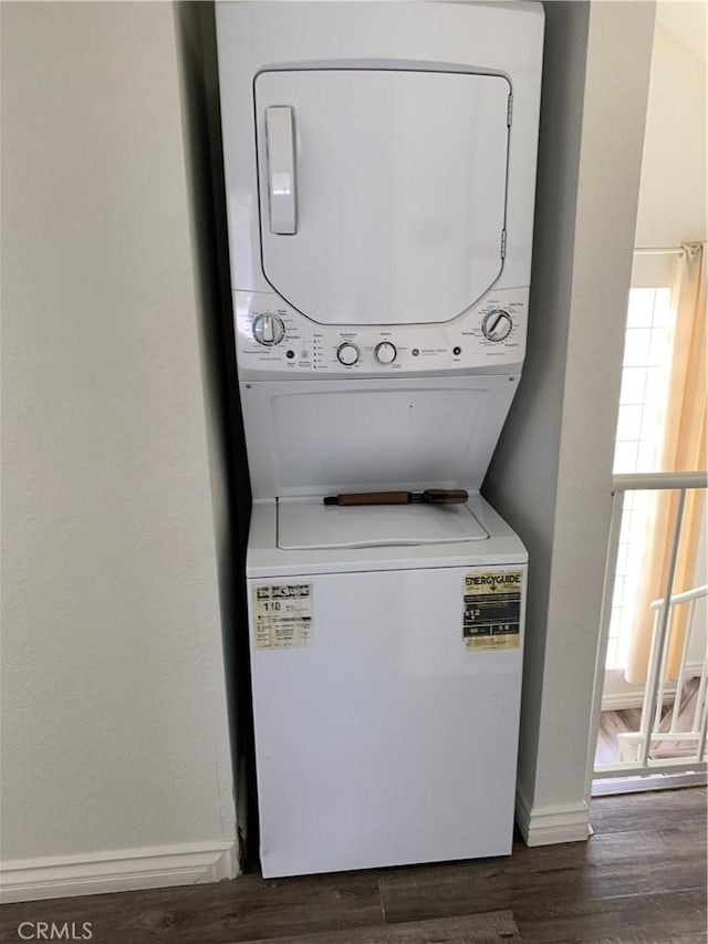 1509 W 146th St Unit 5, Gardena, CA 90247 - washroom featuring stacked washer and clothes dryer and dark wood finished floors