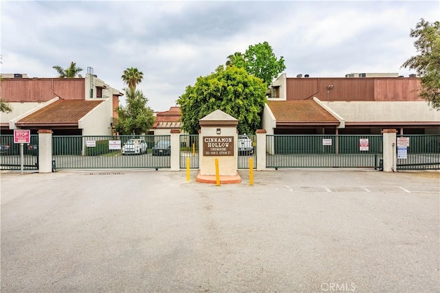 967 S Citron St Unit 3, Anaheim, CA 92805 - view of asphalt road featuring a gate, a gated entry, and traffic signs