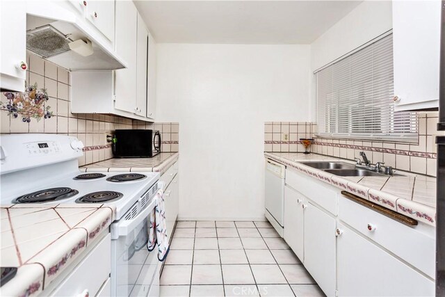 967 S Citron St Unit 3, Anaheim, CA 92805 - kitchen featuring white appliances, tile countertops, range hood, and white cabinetry