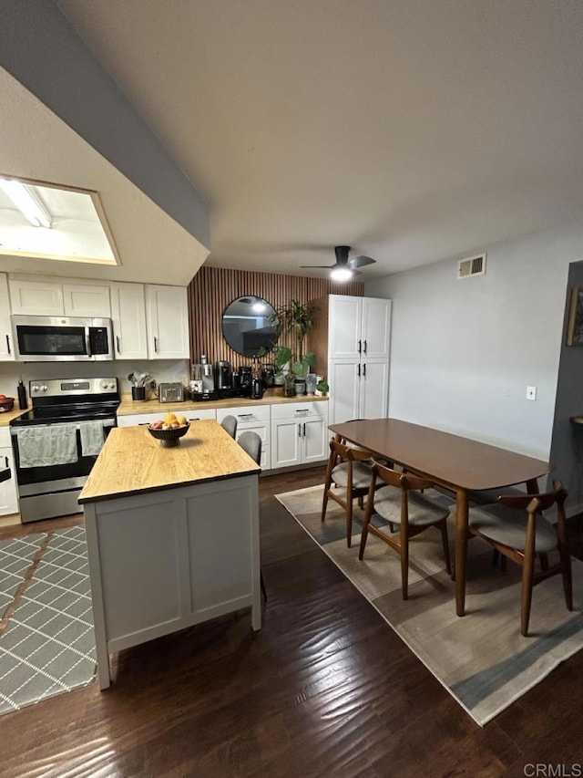 440 Citracado Pkwy Unit 30, Escondido, CA 92025 - kitchen featuring appliances with stainless steel finishes, white cabinets, and dark wood-style floors