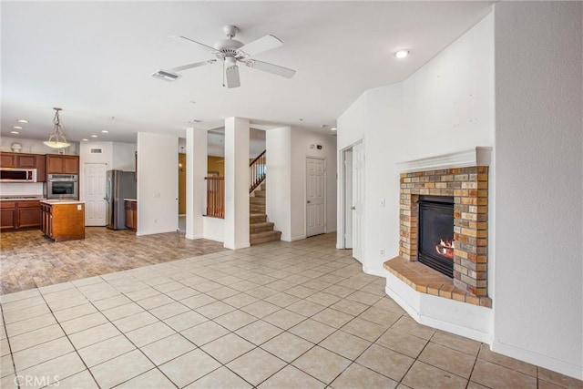 1802 Pummelo Dr, Redlands, CA 92374 - unfurnished living room featuring a ceiling fan, a fireplace, stairs, and recessed lighting
