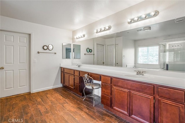 1802 Pummelo Dr, Redlands, CA 92374 - bathroom with double vanity, a stall shower, and wood finished floors