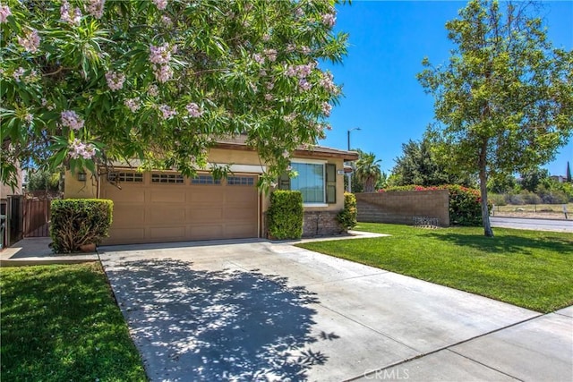 1802 Pummelo Dr, Redlands, CA 92374 - obstructed view of property with concrete driveway, a garage, stucco siding, and stone siding