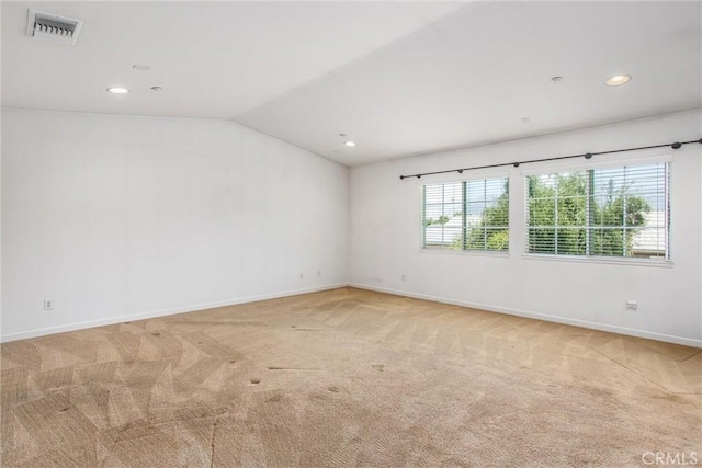 1802 Pummelo Dr, Redlands, CA 92374 - empty room with light carpet, vaulted ceiling, and recessed lighting