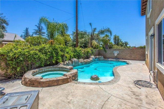1802 Pummelo Dr, Redlands, CA 92374 - view of swimming pool with a patio area, a pool with connected hot tub, and a fenced backyard