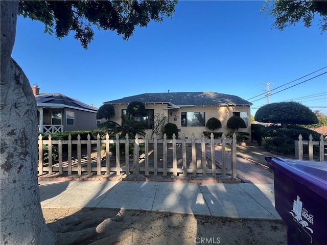 2200 Ximeno Ave, Long Beach, CA 90815 - view of front of home with a fenced front yard and stucco siding