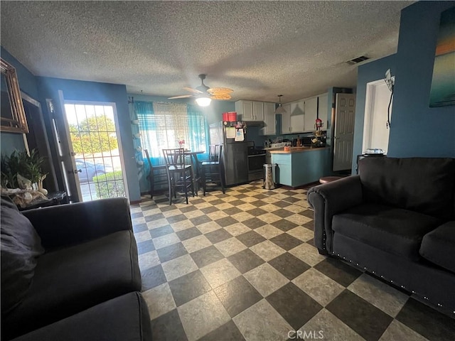 2200 Ximeno Ave, Long Beach, CA 90815 - living area with a textured ceiling, ceiling fan, and tile patterned floors