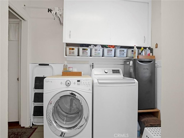 13815 Lexicon Ave, Sylmar, CA 91342 - laundry room featuring independent washer and dryer, water heater, and cabinet space