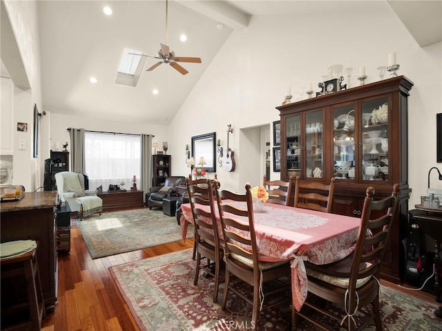 13815 Lexicon Ave, Sylmar, CA 91342 - dining area featuring ceiling fan, high vaulted ceiling, beamed ceiling, wood finished floors, and a skylight