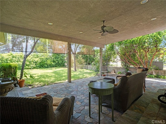 13815 Lexicon Ave, Sylmar, CA 91342 - fenced backyard with a patio area, ceiling fan, and an outdoor living space