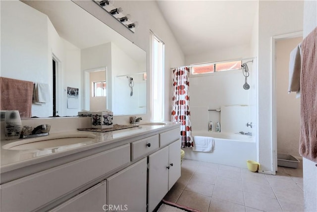 2508 Starbrite Ave, Rosamond, CA 93560 - full bathroom with double vanity, shower / tub combo with curtain, tile patterned flooring, and lofted ceiling