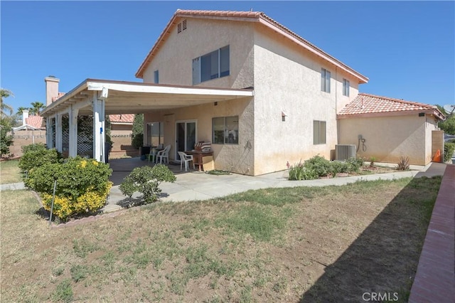 2508 Starbrite Ave, Rosamond, CA 93560 - rear view of house with stucco siding, a tiled roof, and a patio area