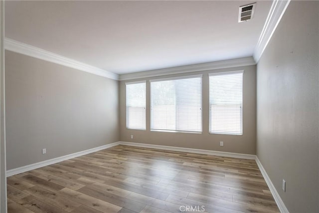 45118 Riverstone Ct, Temecula, CA 92592 - empty room featuring ornamental molding and wood finished floors