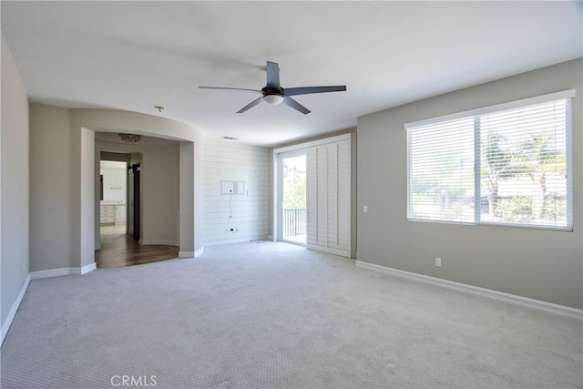 45118 Riverstone Ct, Temecula, CA 92592 - unfurnished bedroom featuring carpet flooring, access to exterior, arched walkways, and ceiling fan