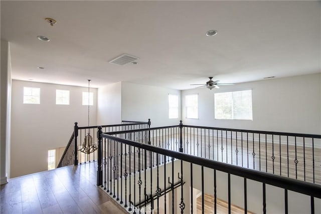 45118 Riverstone Ct, Temecula, CA 92592 - corridor with wood finished floors, an upstairs landing, and recessed lighting