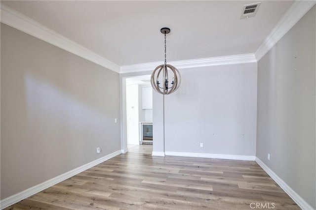 45118 Riverstone Ct, Temecula, CA 92592 - unfurnished dining area featuring crown molding, a chandelier, and light wood-style flooring
