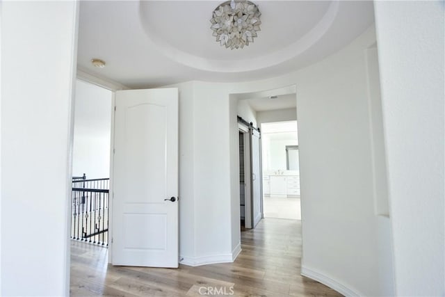 45118 Riverstone Ct, Temecula, CA 92592 - corridor featuring wood finished floors and a barn door